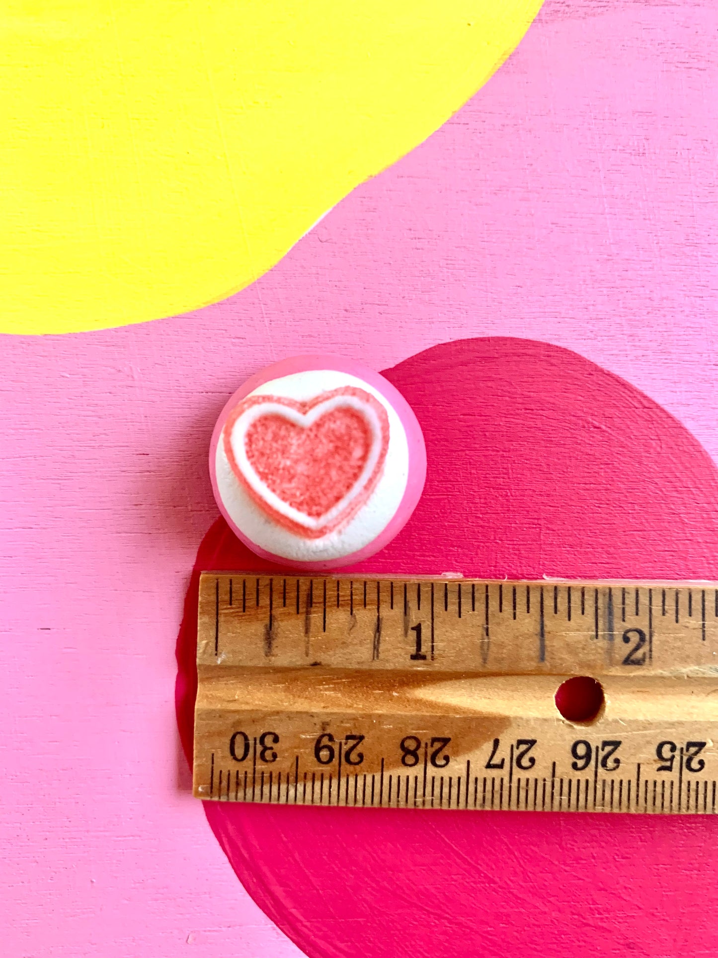 White Icing with Pink Heart Gummy Cookie