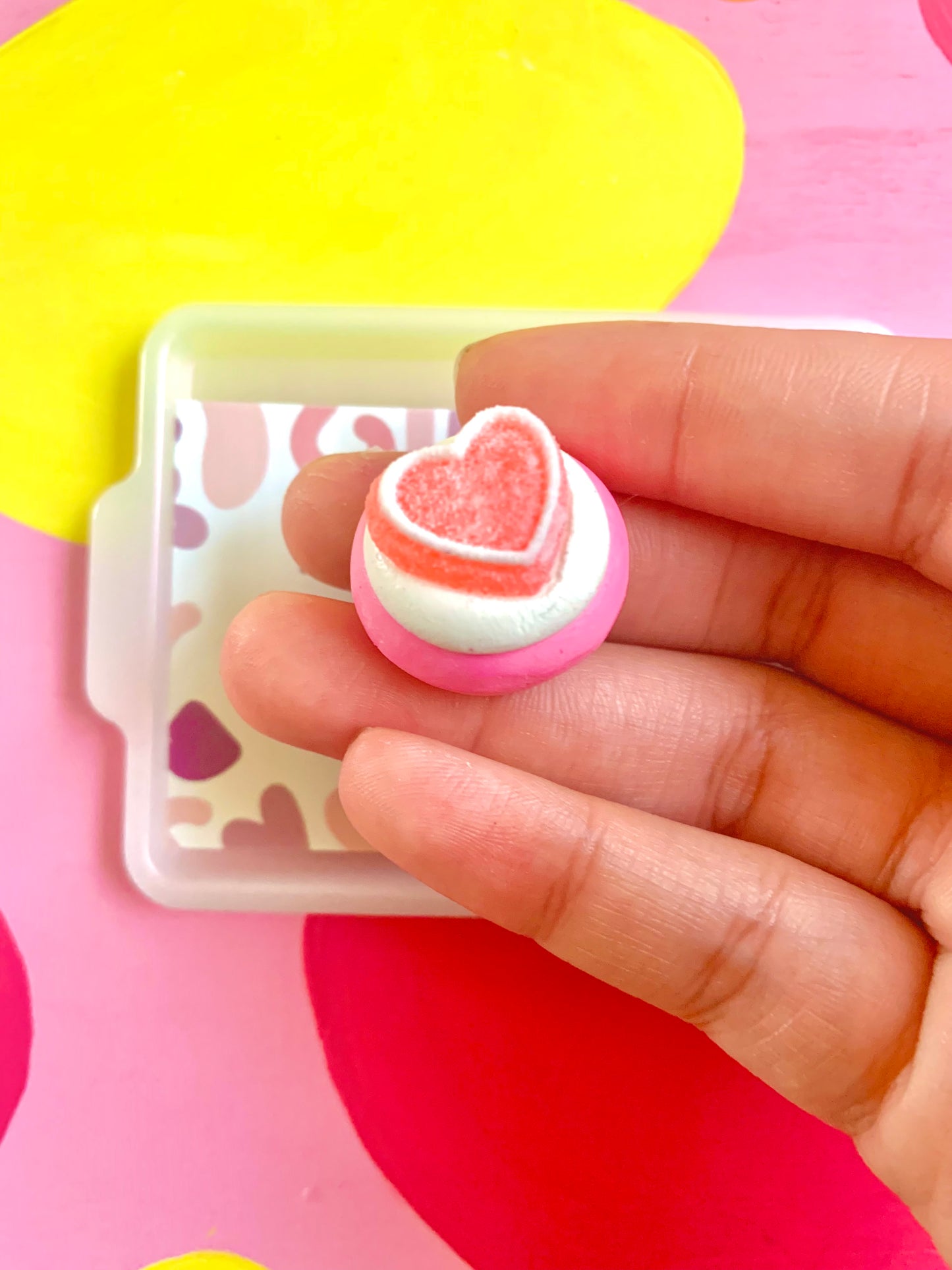 White Icing with Pink Heart Gummy Cookie