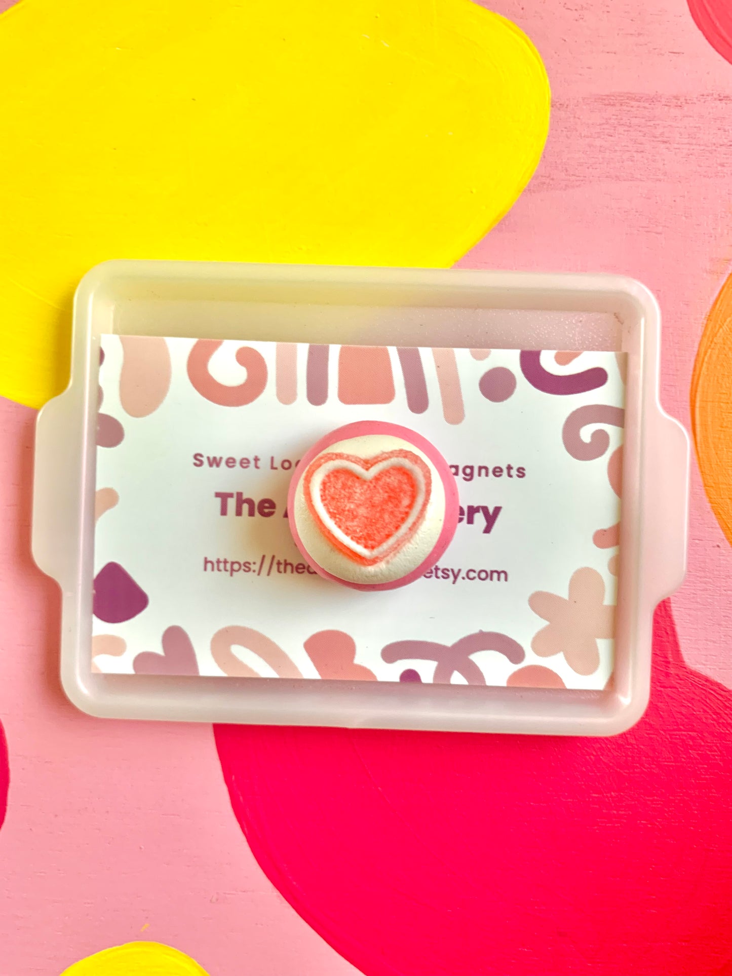 White Icing with Pink Heart Gummy Cookie