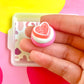 White Icing with Pink Heart Gummy Cookie
